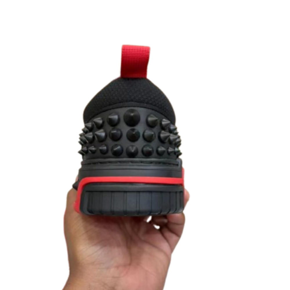 Black and red chunky sneakers with lace-up design, padded collar and sporty streetwear style