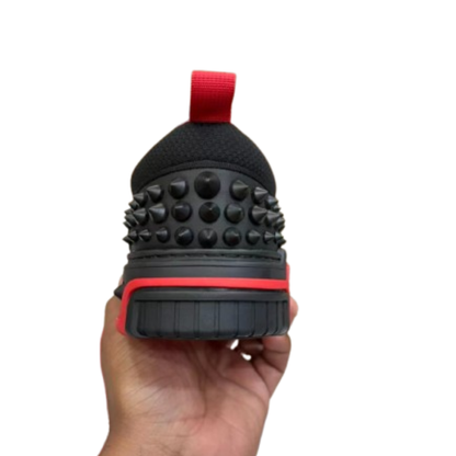 Black and red chunky sneakers with lace-up design, padded collar and sporty streetwear style