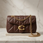 Luxury brown quilted leather shoulder bag with gold chain strap and elegant metal clasp