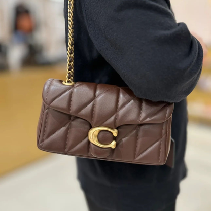 Luxury brown quilted leather shoulder bag with gold chain strap and elegant metal clasp